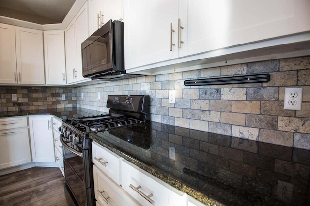 kitchen with white cabinets, black appliances, dark hardwood / wood-style flooring, dark stone counters, and tasteful backsplash