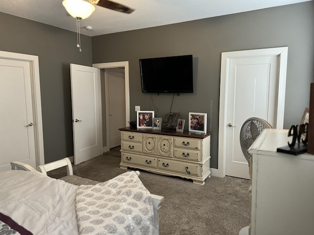 carpeted bedroom with ceiling fan