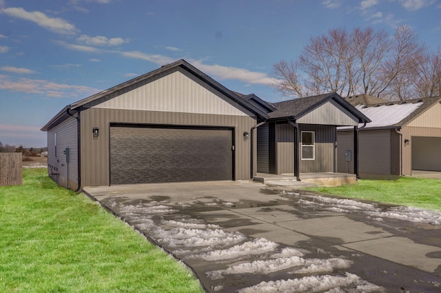 single story home featuring a garage and a yard