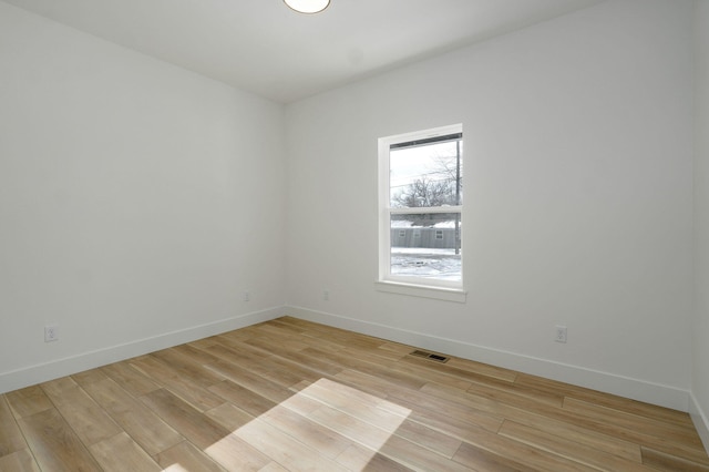 spare room featuring light hardwood / wood-style flooring