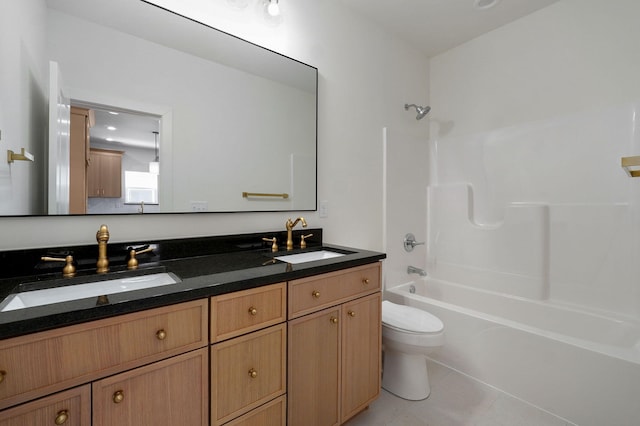 full bathroom featuring tile patterned floors, bathtub / shower combination, toilet, and vanity