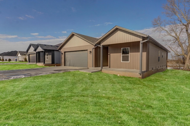 view of front facade with a front yard and a garage