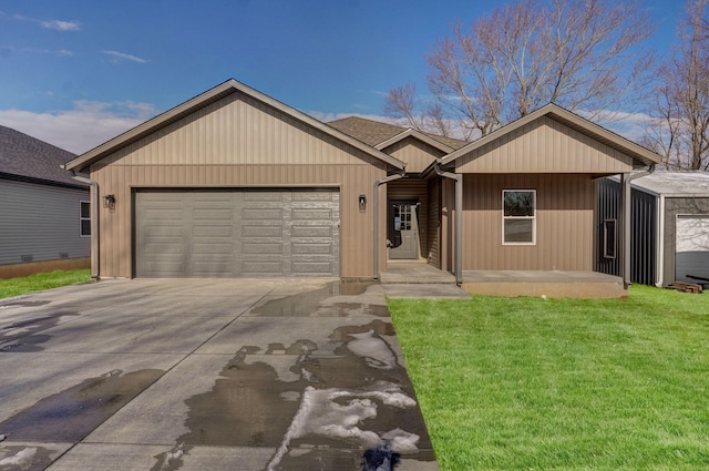 single story home with a garage and a front lawn