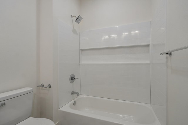 bathroom with toilet and bathing tub / shower combination