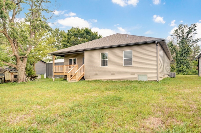 210B W Clinton St, Rogersville, MO 65742 - rear view of house featuring a yard, a wooden deck, a shed, and a shingled roof