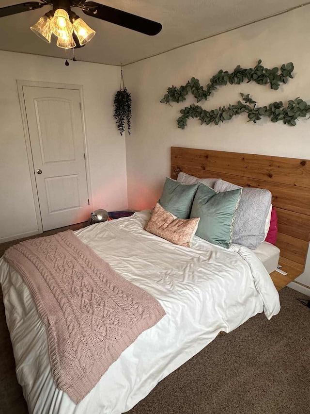 bedroom featuring ceiling fan and carpet flooring