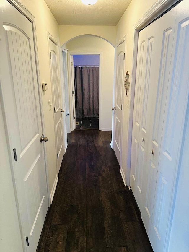 hall with dark hardwood / wood-style floors