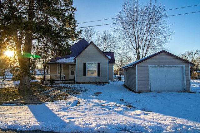 view of front of home with an outdoor structure, a porch, and a garage