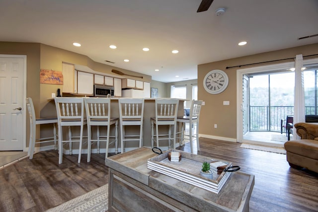 living room with dark wood-type flooring