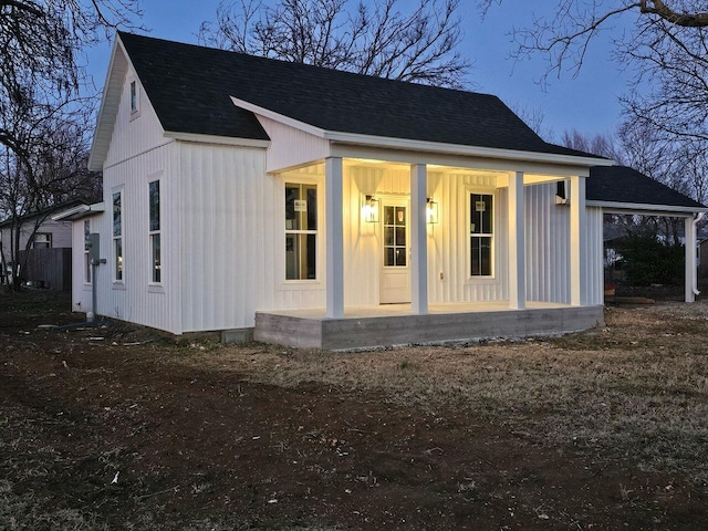 view of property exterior with covered porch