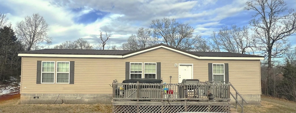 manufactured / mobile home featuring a deck