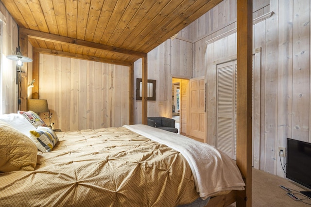 carpeted bedroom featuring beamed ceiling, wooden walls, and wooden ceiling