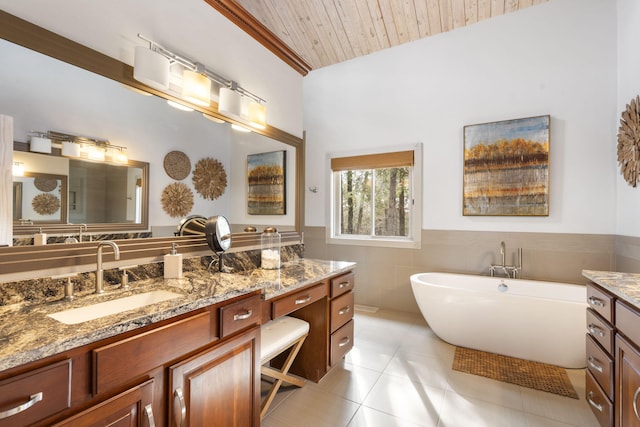 bathroom featuring wood ceiling, tile patterned flooring, vanity, tile walls, and a bath