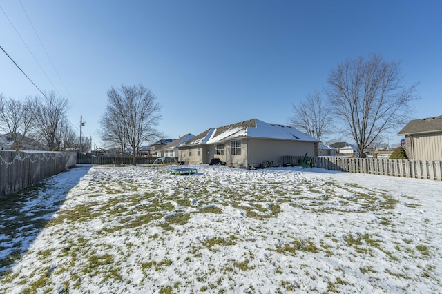 view of yard covered in snow