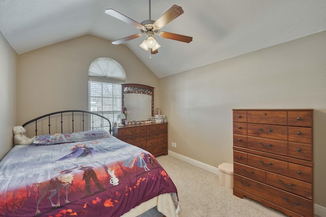 carpeted bedroom featuring ceiling fan and lofted ceiling