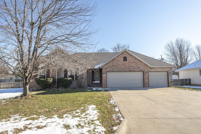 ranch-style home with a front yard and a garage