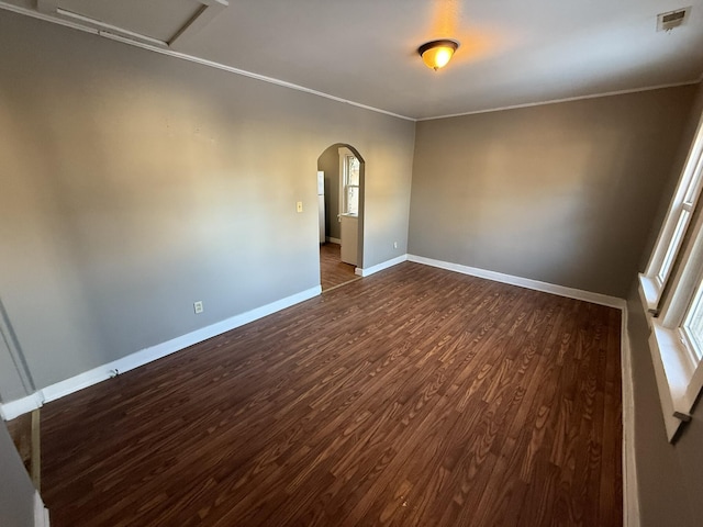 spare room with dark hardwood / wood-style flooring