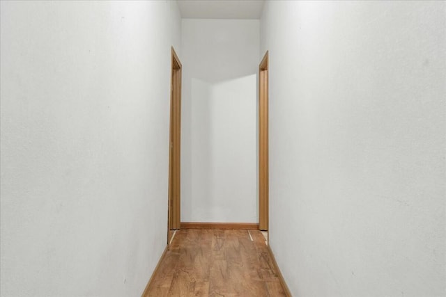 hallway featuring light hardwood / wood-style flooring