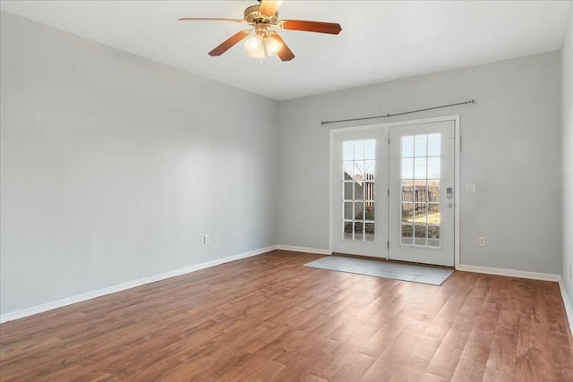 unfurnished room with light wood-type flooring and ceiling fan