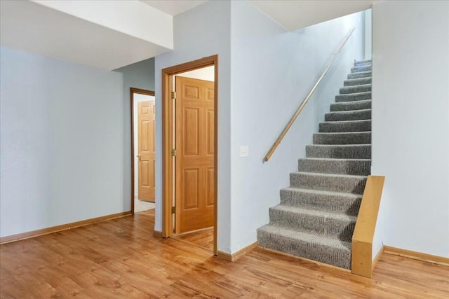 stairs with wood-type flooring