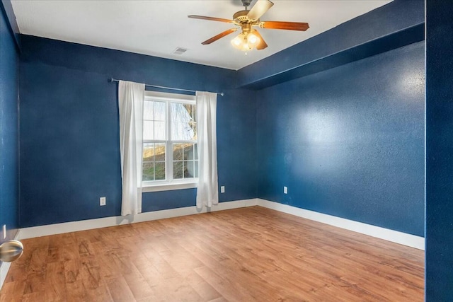 unfurnished room featuring ceiling fan and wood-type flooring