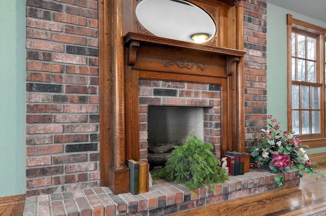 interior details with a brick fireplace