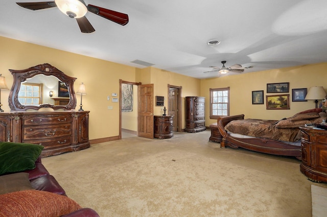 carpeted bedroom with ceiling fan