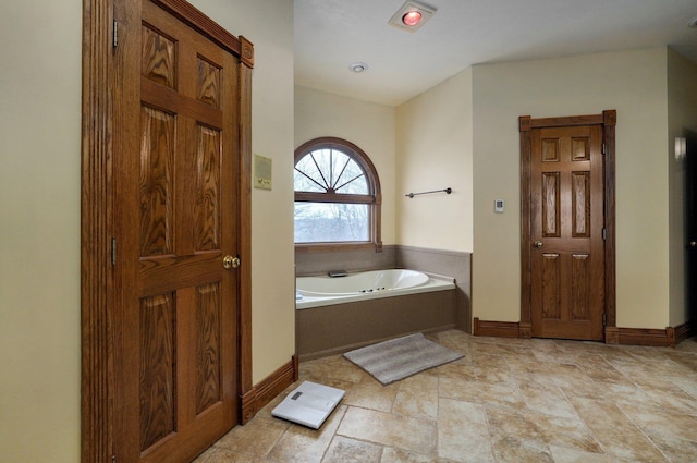 bathroom featuring a washtub