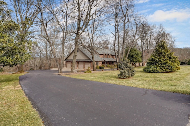 view of front of house with a front lawn and a garage