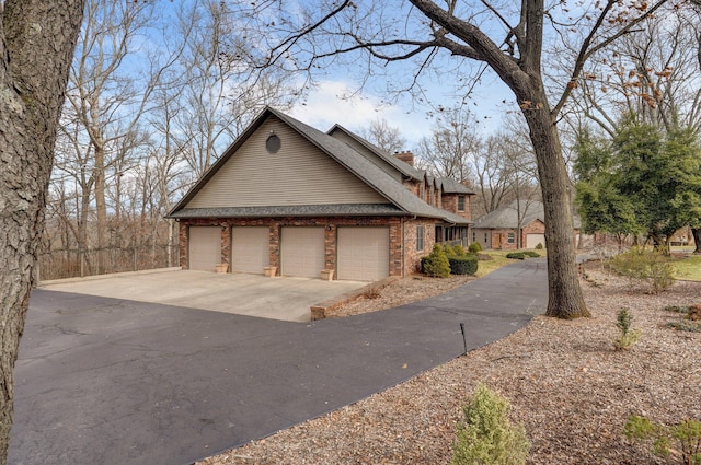 view of property exterior with a garage