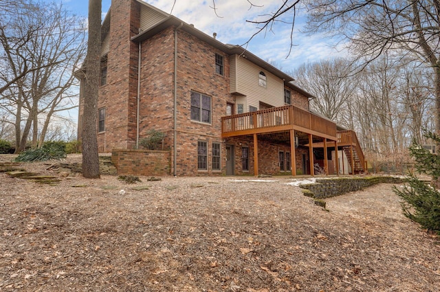 rear view of property with a wooden deck