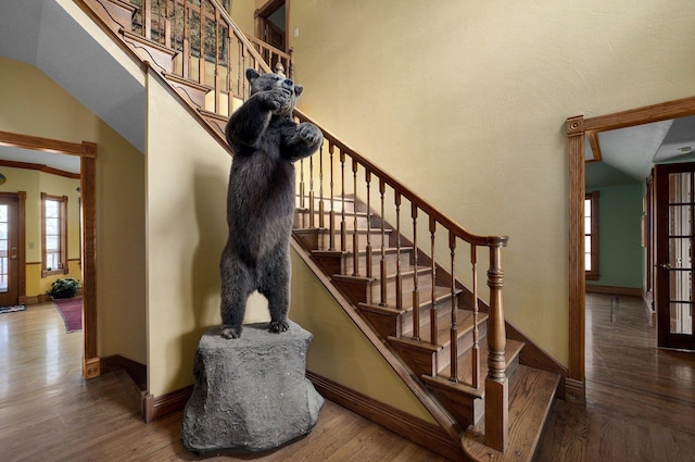 stairs with hardwood / wood-style flooring