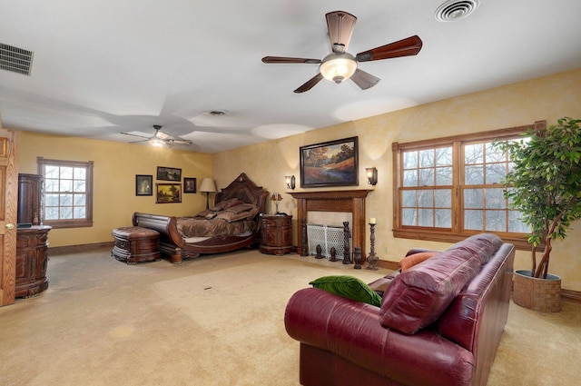 living room featuring ceiling fan and light colored carpet