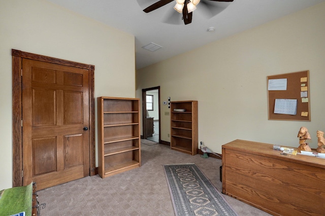 interior space featuring ceiling fan and light colored carpet