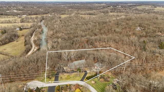 birds eye view of property with a rural view