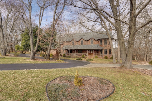 view of front of house with a front lawn and covered porch