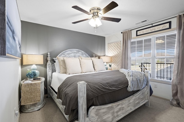 carpeted bedroom with ceiling fan