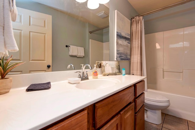 full bathroom with toilet, tile patterned flooring, vanity, and shower / bath combo with shower curtain