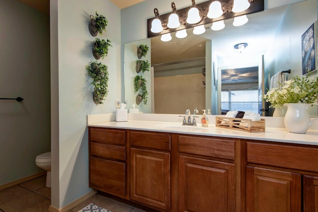 bathroom with tile patterned floors, vanity, and toilet