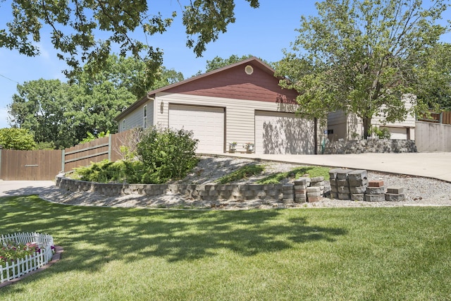 view of front of home with a front lawn and a garage