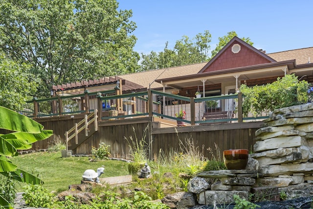 back of property with a wooden deck