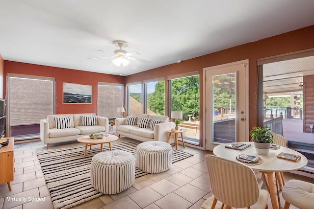 tiled living room with ceiling fan