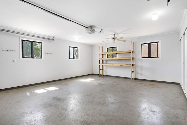 garage featuring ceiling fan and a garage door opener