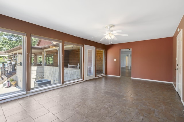 unfurnished room featuring ceiling fan