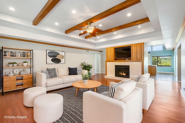 living room featuring ceiling fan and light hardwood / wood-style flooring