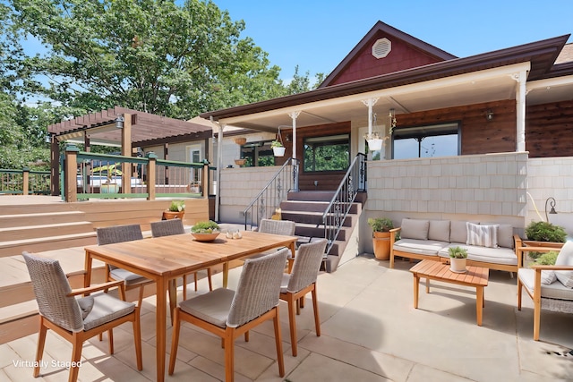 view of patio / terrace featuring an outdoor living space and a pergola