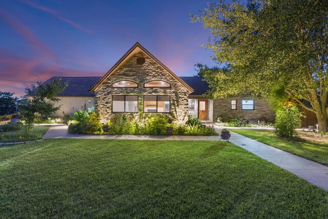 view of front of house with a yard