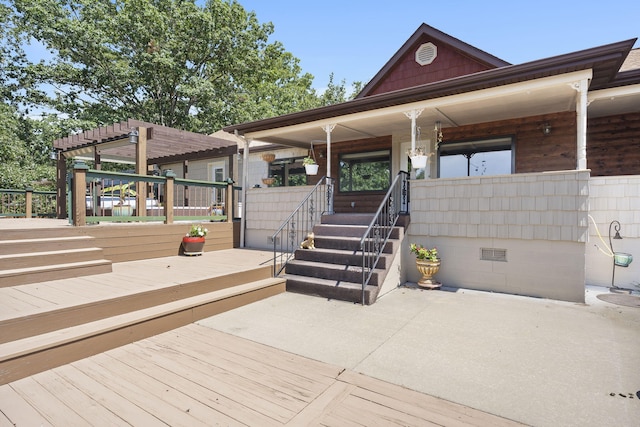 view of front of house featuring a pergola and a deck