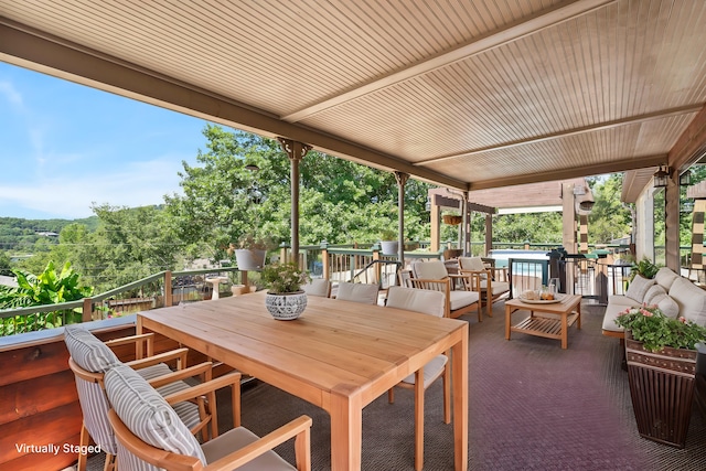 view of patio featuring outdoor lounge area and a swimming pool