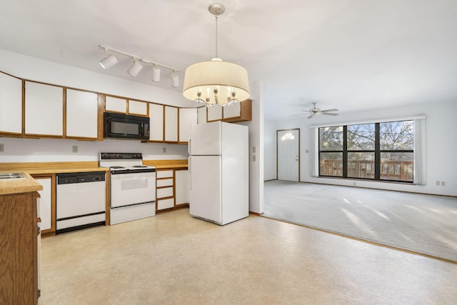 kitchen featuring decorative light fixtures, white appliances, white cabinets, and ceiling fan with notable chandelier